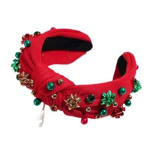 Cerchietto natalizio rosso annodato con perle festive, fiocchi d'oro e strass lucenti