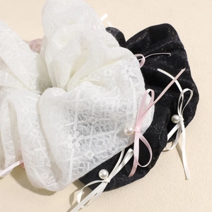 Elegant oversized lace hair scrunchies with satin bows and pearls in black and white