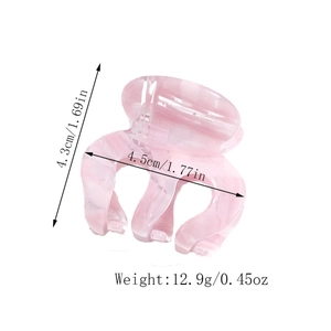 Detailed view of pink translucent acetate hair claw clip with specific size measurements