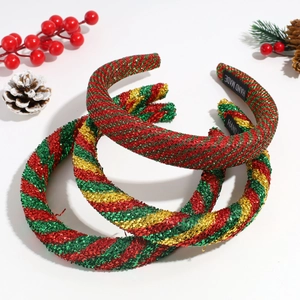 Three padded Christmas headbands in festive red green gold glitter textured knot design