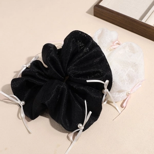 Elegant oversized lace scrunchies with white ribbons and imitation pearls in black and white