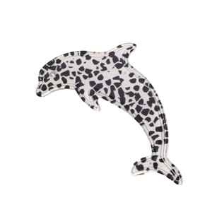 Acetate leopard dolphin hair clip with white rhinestone accent on white background