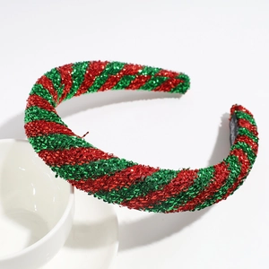 Detail of red and green glitter woven Christmas headband with sponge padding texture