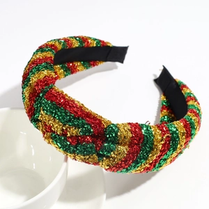 Detail of a Christmas headband featuring red, green, and gold glitter tinsel braided texture