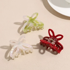 Elegant butterfly hair claws in pearly white, green, and red for women's hairstyling