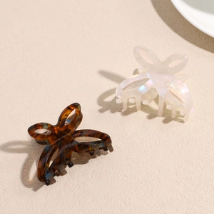 Elegant butterfly hair claw clips set in tortoise shell and pearlescent white finish