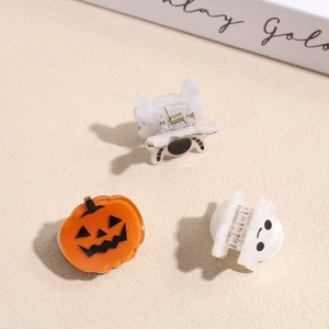 Halloween hair claw set featuring pumpkin, ghost, and cat motifs in glossy acetate material