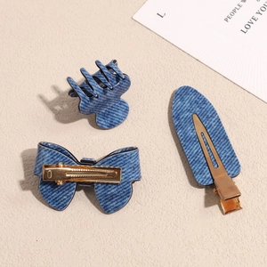Set of 3 denim blue hair clips featuring bow and oval designs with gold-plated metal