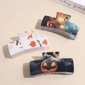 Halloween square hair claws featuring ghosts, pumpkins and bats patterns on colorful bases