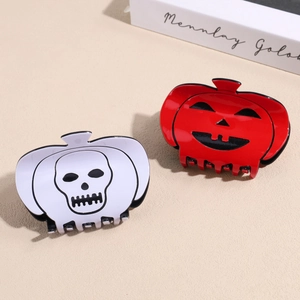 Pinces à cheveux d'Halloween avec motifs de crânes et citrouilles sur fini rouge et blanc