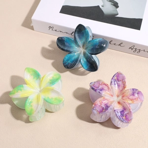 Pinces à cheveux fleurs dégradées avec texture marbrée en bleu, jaune et violet