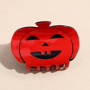Pince à cheveux citrouille rouge brillant avec visage de Halloween Jack-O'-Lantern