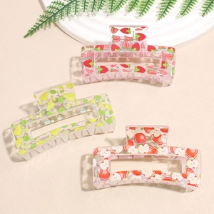 Three fruit-themed square acrylic hair claws with strawberry, pear and apple prints