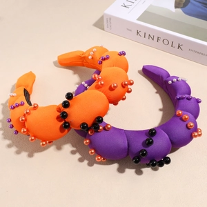 Padded pearl headband set in orange and purple fabric with colorful beaded accents