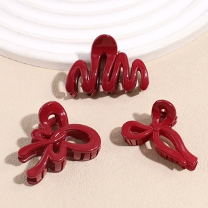 Three-piece set of elegant deep red hair claws featuring wave and butterfly designs
