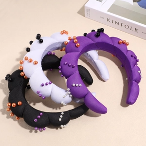 Three-piece set of twisted pearl sponge headbands in purple, white, and black colors