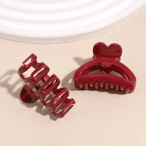 Elegant dark red hair claw clips with heart detail and glossy finish for women