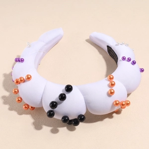 Close-up of padded sponge headband with Halloween colorful pearl beads and white fabric wrap