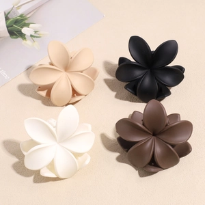 Set of four matte flower hair claws in cream, black, white, and brown Morandi tones
