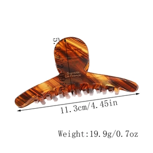 Detail view of large tortoiseshell hair claw with size 11.3cm and weight measurements