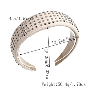 Macro view of cream faux leather headband with silver rivet studs and 4cm wide band design