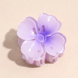 Pince à cheveux fleurie dégradé violet avec finition mate pour queues de cheval hautes