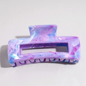 Detail of blue and purple marble texture hair claw clip with nonslip rectangle design