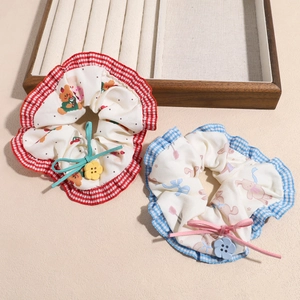 Cute cherry and bunny fabric scrunchies with floral buttons and bow details
