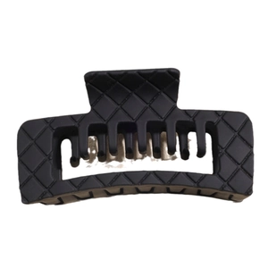 Matte black large hair claw clip with a classic quilted pattern and square design
