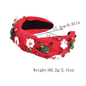 Vue détaillée du serre-tête de Noël rouge avec motifs Santa, perles et strass
