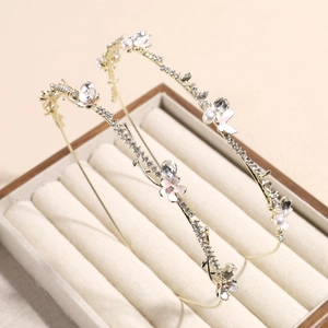 Elegant gold headband with floral enamel, white pearls and sparkling rhinestones