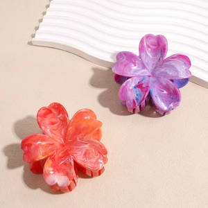 Fashionable floral hair claw clip with pink and orange gradient marble acrylic finish