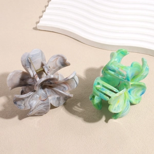 Elegant floral hair claws in gradient marble and blue-green textures for daily styling