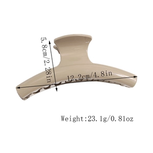 Detail view of milk tea brown shark hair claw clip with size measurements in centimeters