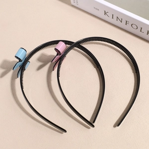 Two-pack vintage black non-slip headbands with light blue and pink bow accents