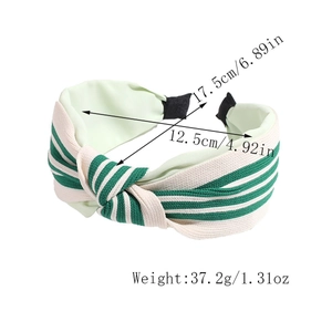Detail showing green striped knotted headband with width and weight measurement markers