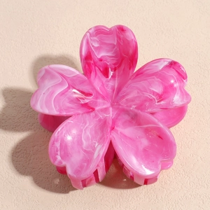 Detailed close-up of a pink marble resin flower hair claw clip with gradient petals