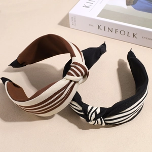 Two-pack of elegant wide striped knot headbands in brown and black ribbed fabric