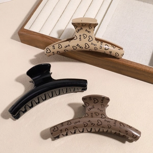 Elegant Maillard heart hair claw clips in beige, black, and coffee for a minimalist style