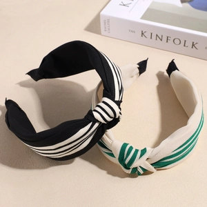 Elegant wide knotted headbands with classic striped patterns in black and beige colors