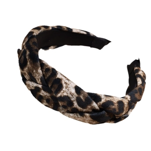 Padded leopard print twisted headband with velvet texture and brown cheetah pattern