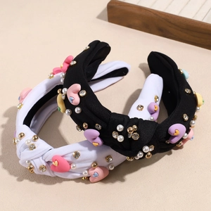 Baroque style knotted headbands with hearts, pearls and rhinestones in black and white