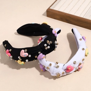Baroque twist headband set with colorful hearts, pearls and crystals on beige background