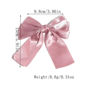 Detail view of pink satin double-layered bow hair clip with measurement dimensions