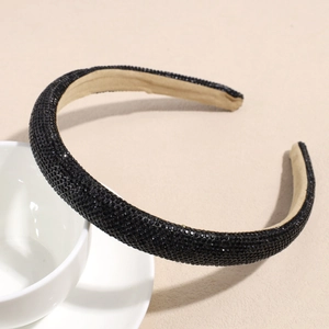 Detail of black rhinestone headband with beige anti-slip fabric lining for comfort
