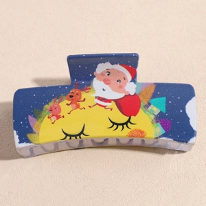 Detail of navy blue Christmas hair claw with Santa Claus, reindeer and moon patterns