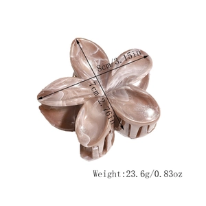 Detail showing marble texture frangipani hair claw clip with size 8cm by 7cm