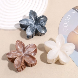 Elegant marble pattern frangipani hair claws in cream, grey, and brown colors