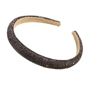 Sparkling dark gray rhinestone headband with padded wide sponge design on white background