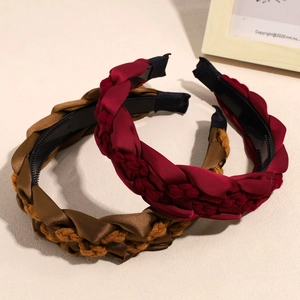 Braided fabric headbands in dark red and mustard yellow with anti-slip inner lining